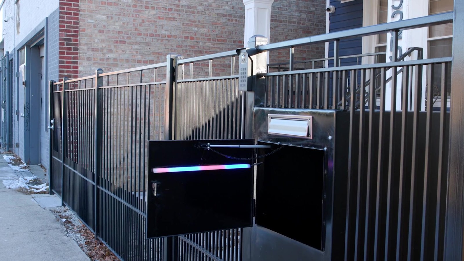 Smart Mailbox at a controlled property entrance